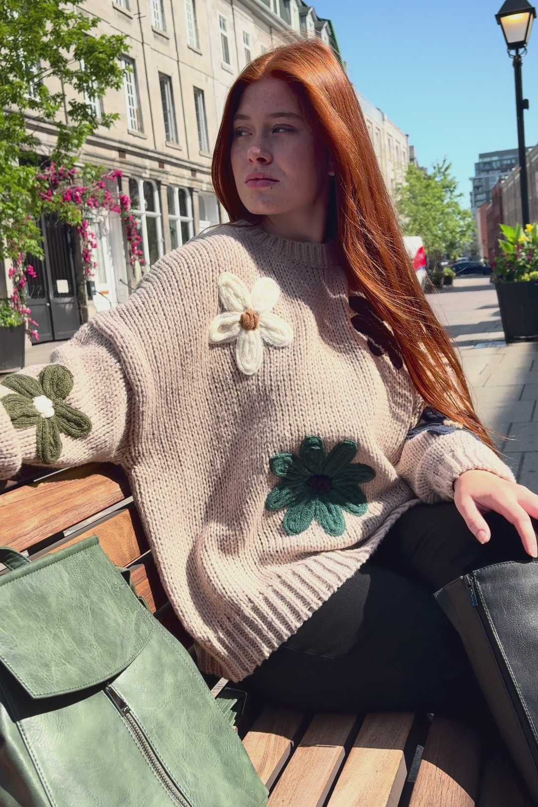 Applique embroidered knitwear with decorative elements