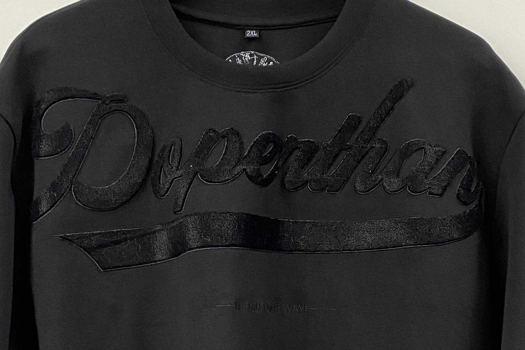 Flocking embroidery detail on custom sweater