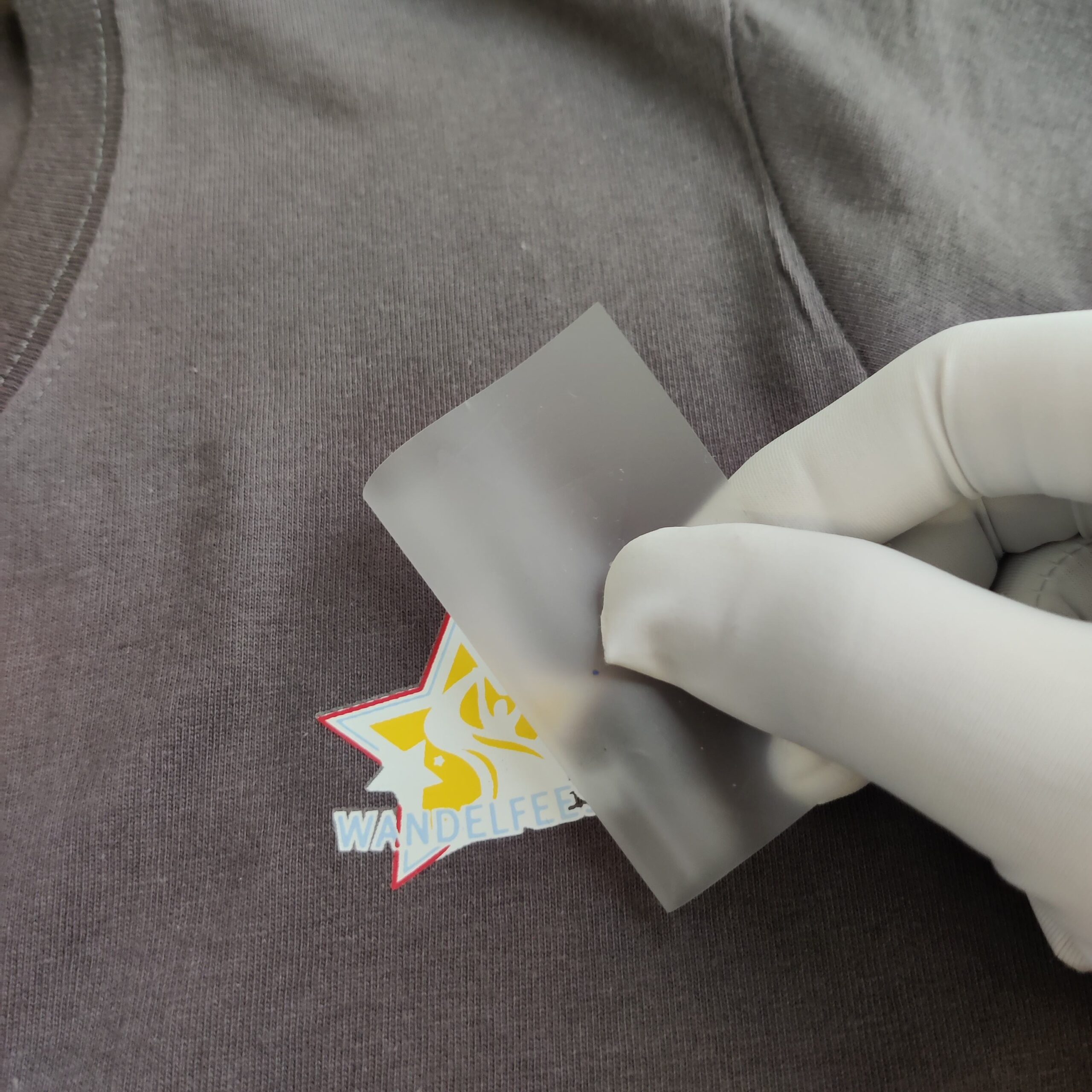 Heat transfer label for sweater garment branding