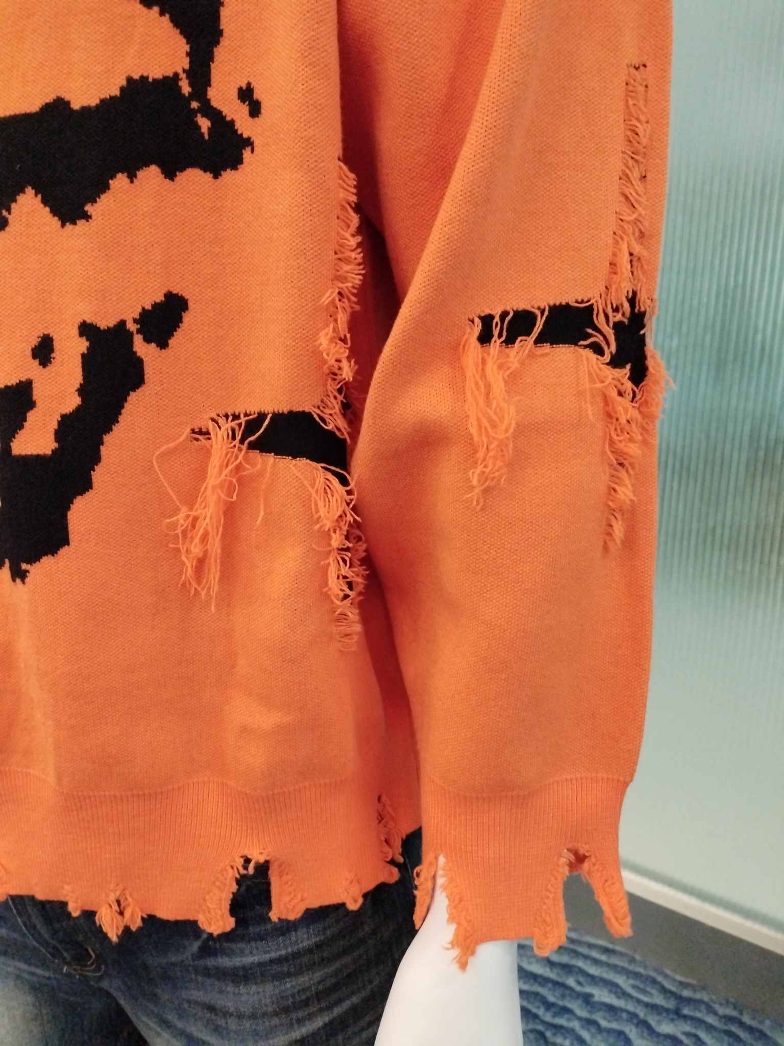 Knit sweater detail showing stitch construction