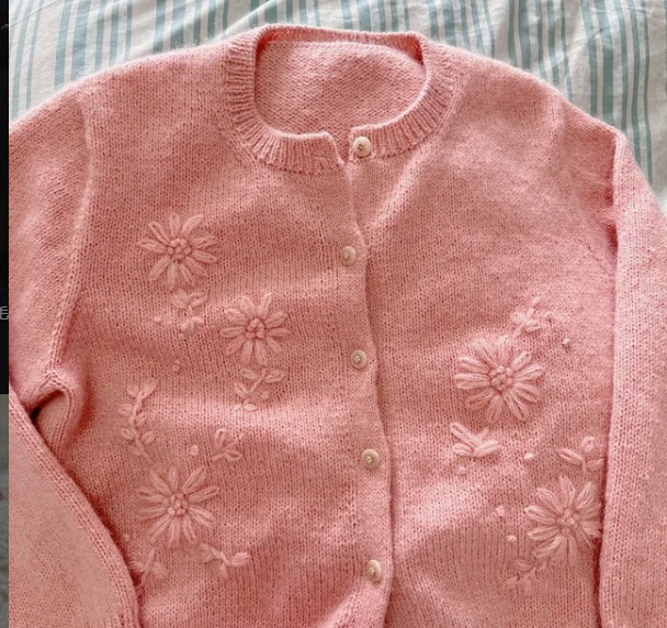 Sweater embroidery detail for custom knitwear
