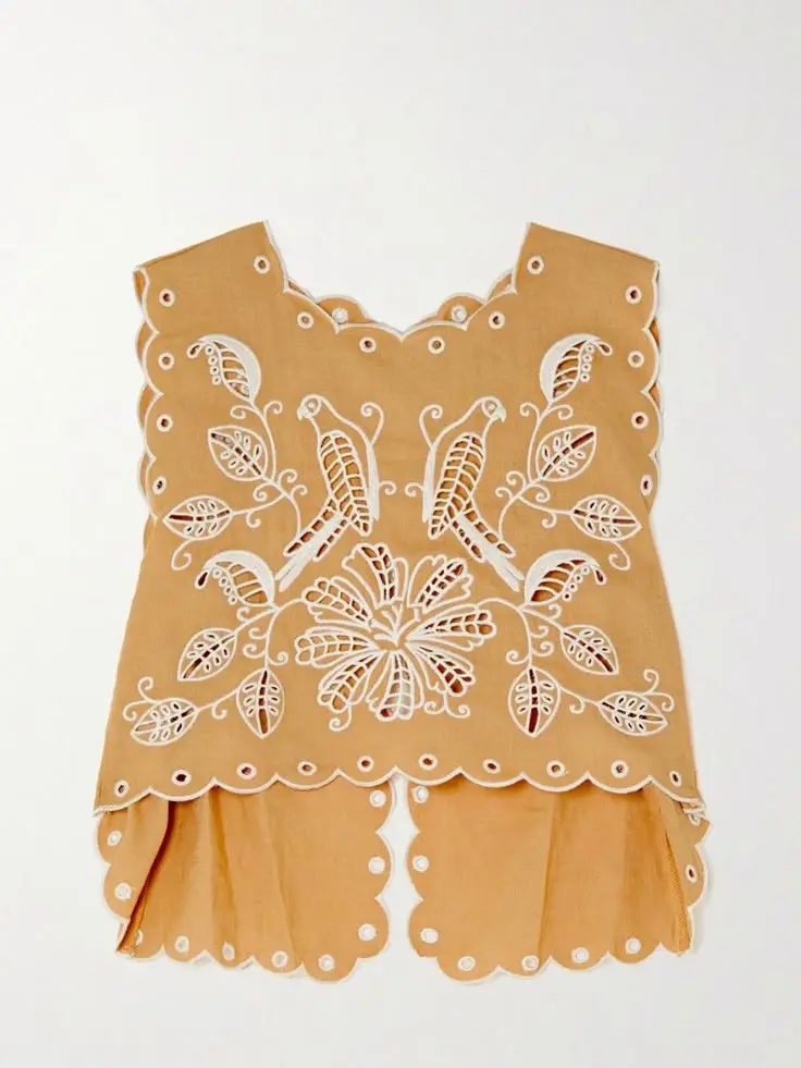 Knit top with eyelet embroidery detail